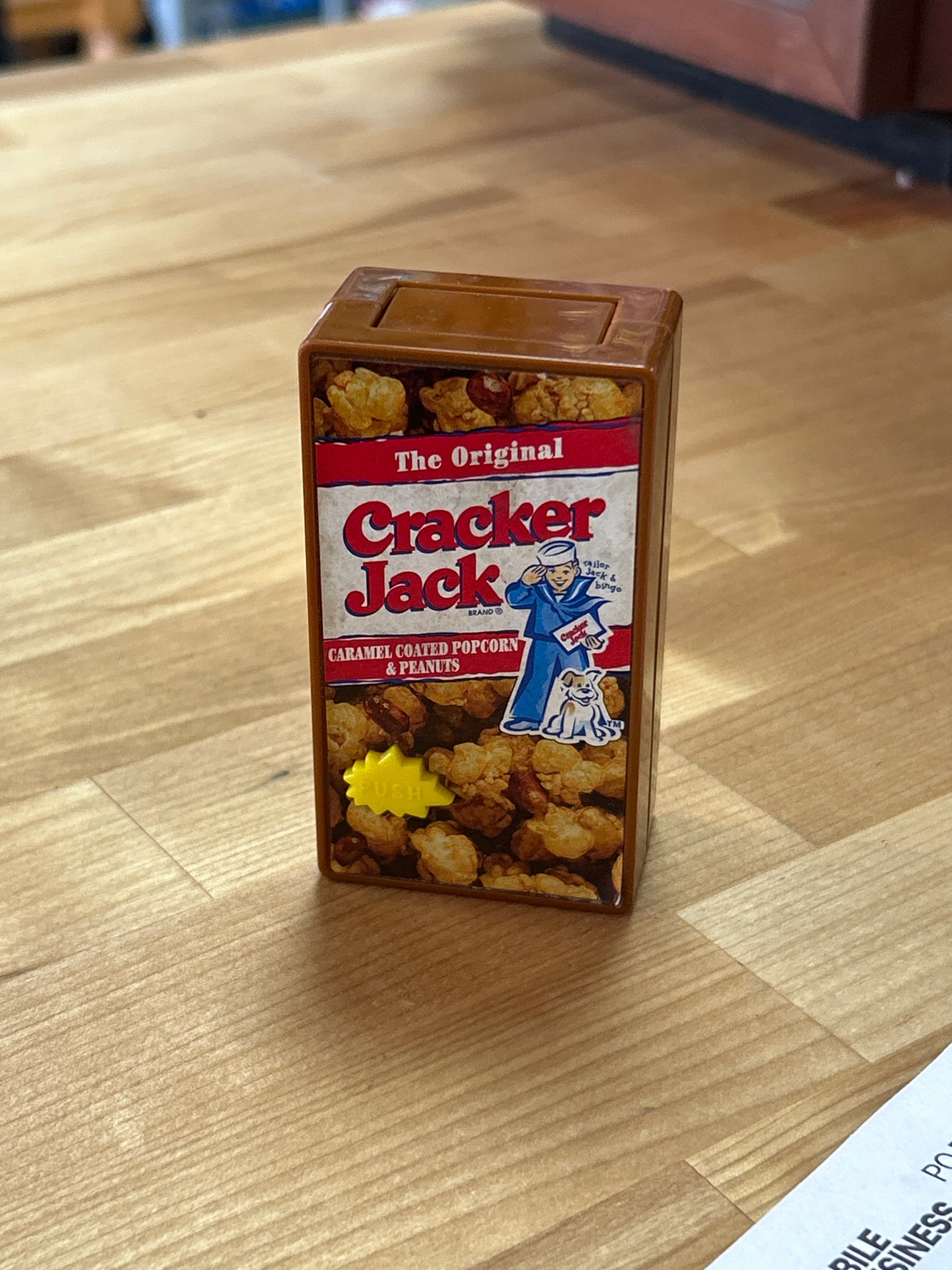 Cracker Jack (push button, pop out magnifying glass)