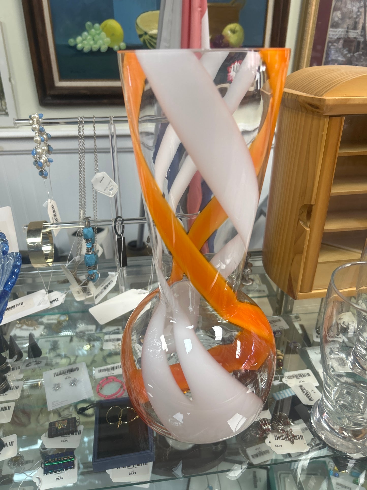 Vintage hand-blown art glass vase featuring an orange and white swirl pattern 14