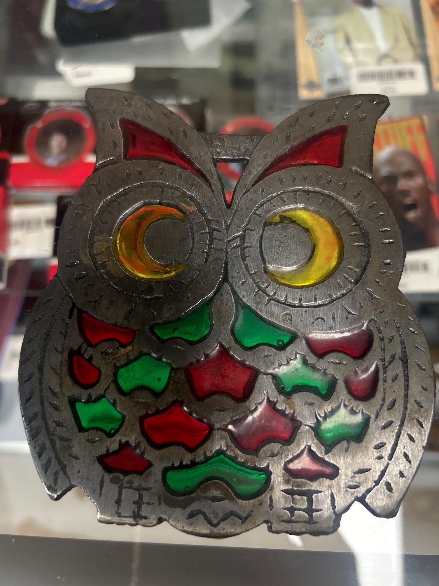 unbranded 1970s owl trivet cast metal construction with red and green faux stained glass inserts