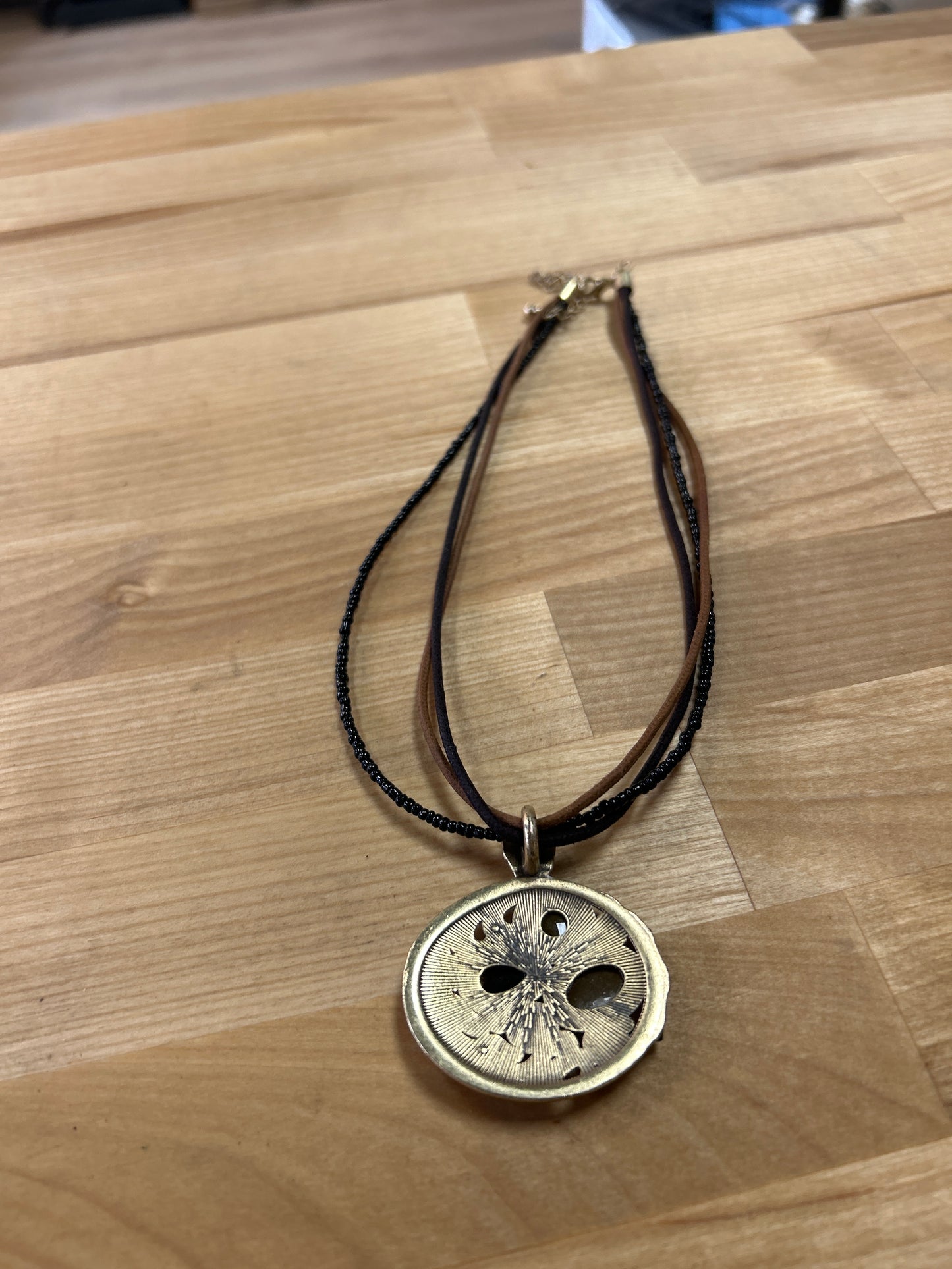 Metal, leather, bead necklace pre-owner
