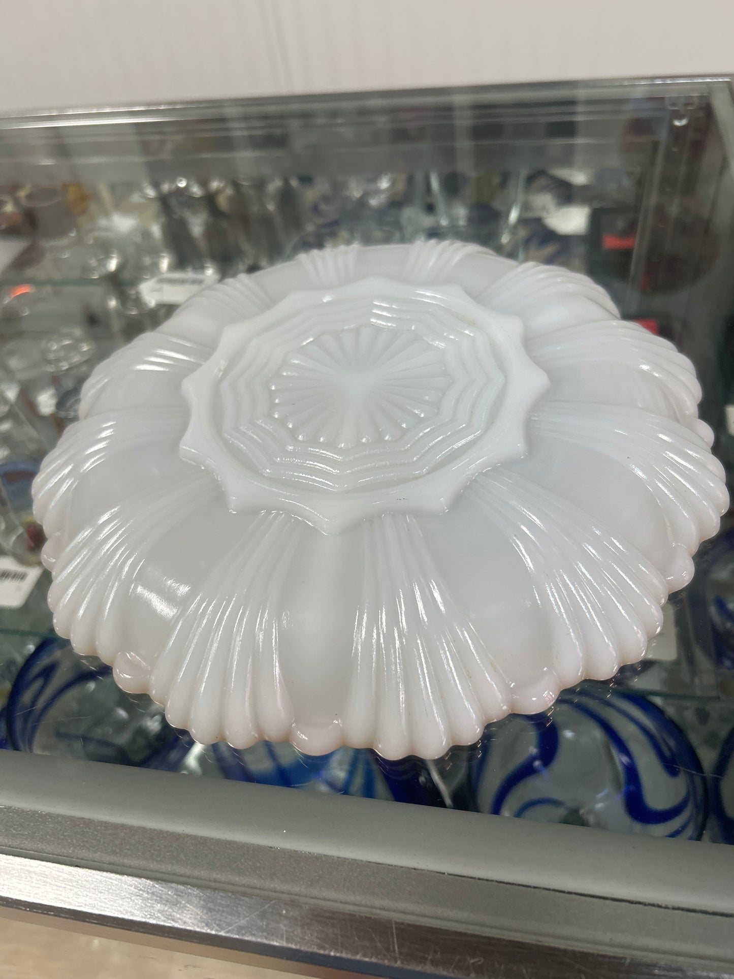 Vintage Anchor Hocking Fire-King milk glass divided relish tray or serving dish, often featuring gold trim around the scalloped rim.