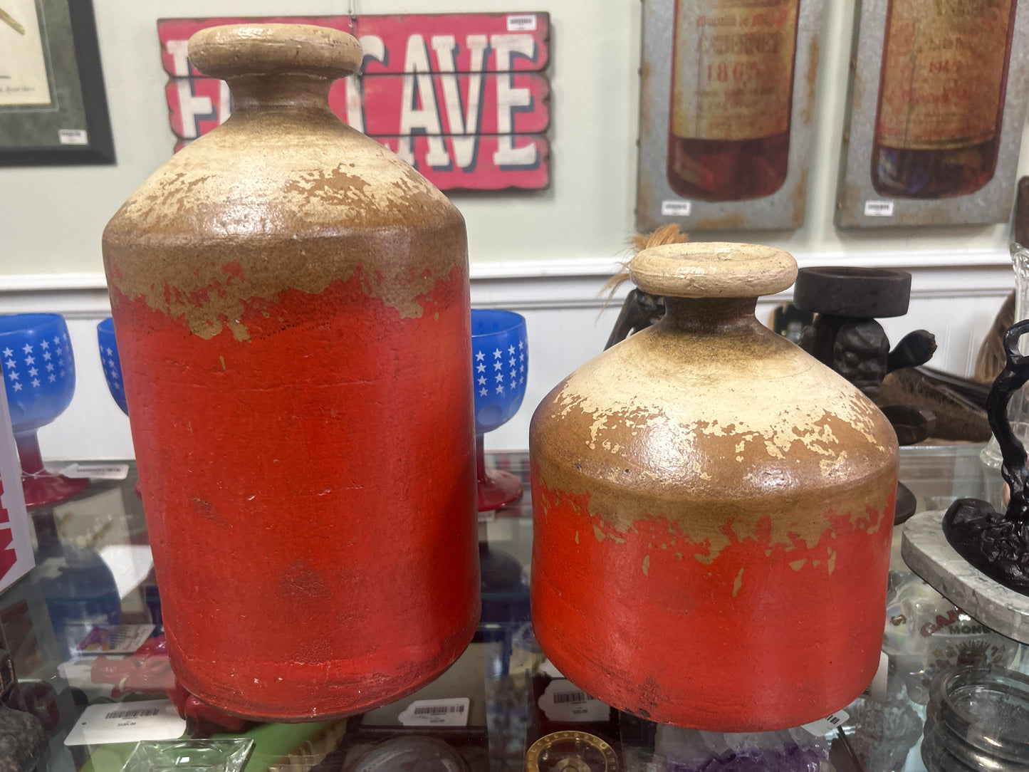 primitive-style red and beige ceramic jugs
