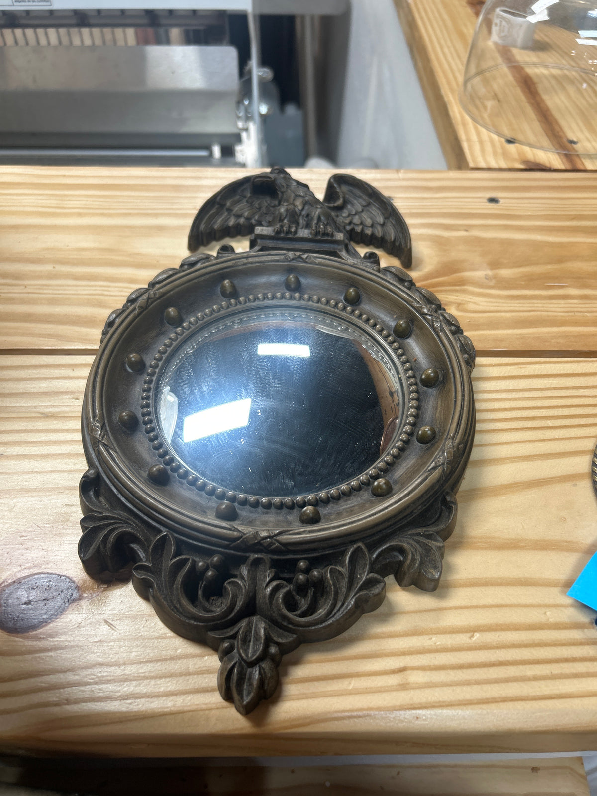 Vintage Homco Federal Eagle convex porthole mirror featuring a bronzed plastic frame and a distinctive eagle motif