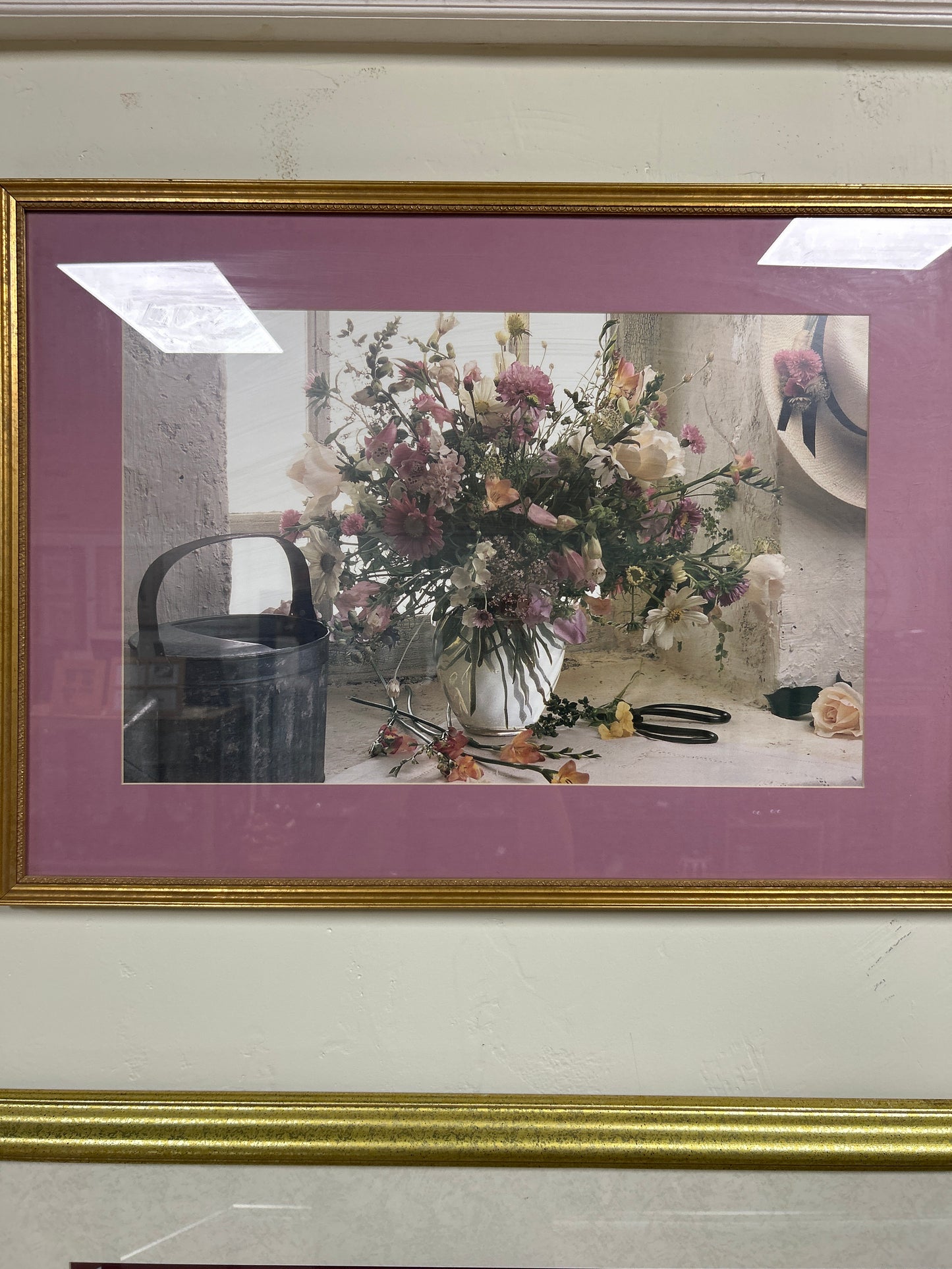 Framed and matted print of a flower arrangement