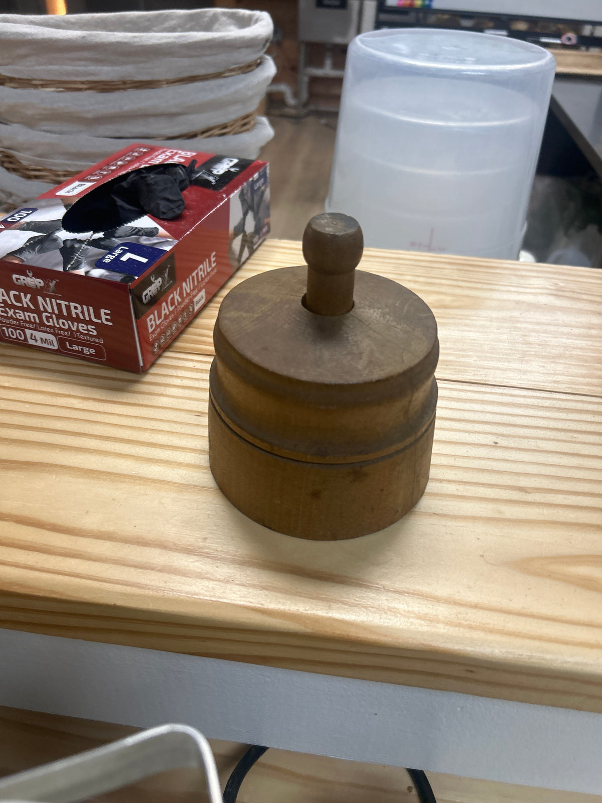 vintage wooden plunger-style butter mold has cracks