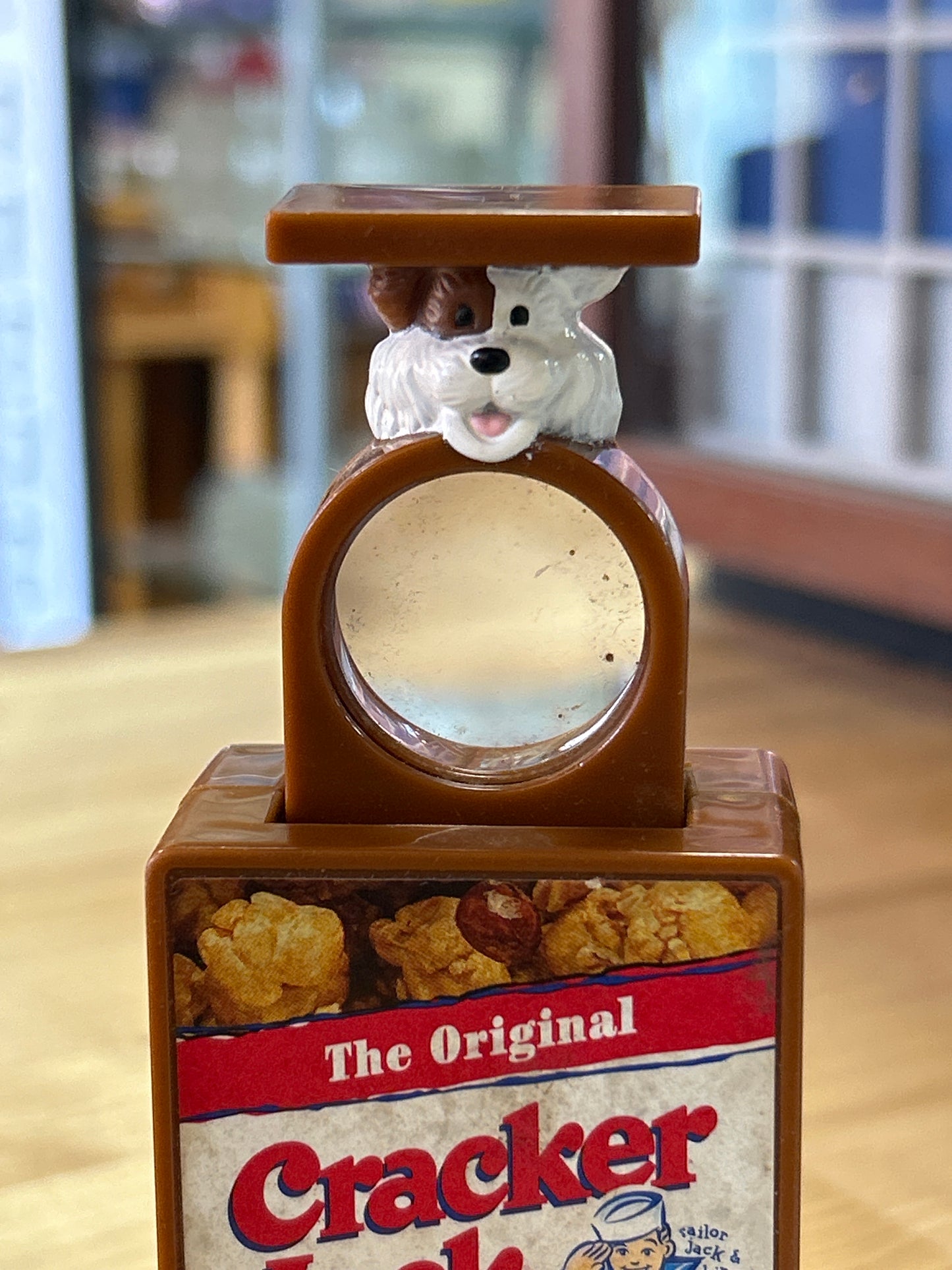 Cracker Jack (push button, pop out magnifying glass)