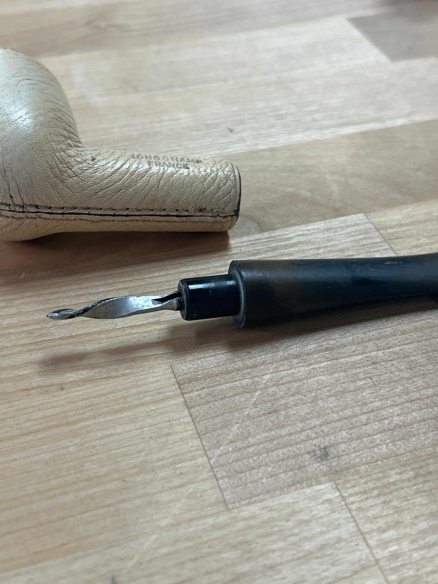 Vintage Longchamp leather pipe ( we don’t know anything about pipes. This may need a cleaning to fully insert mouth piece)