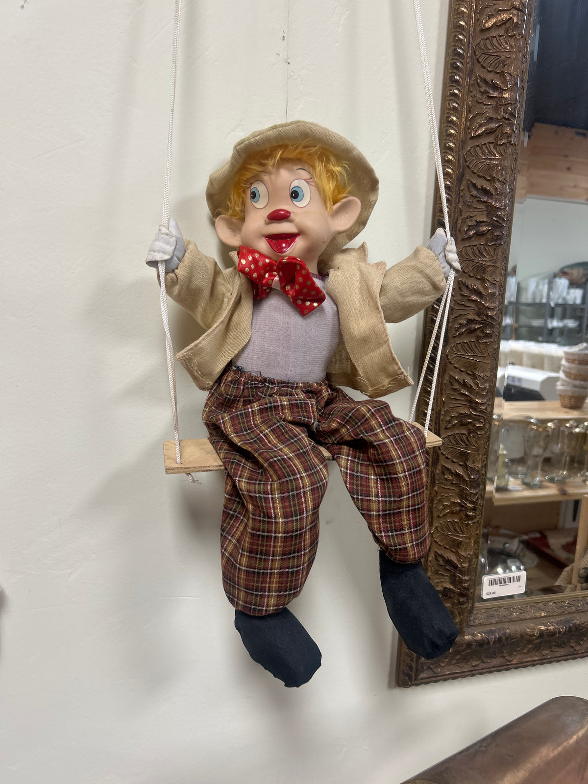 Vintage marionette puppet, likely from the Monarch Collection, featuring a porcelain clown head, hands, and feet.