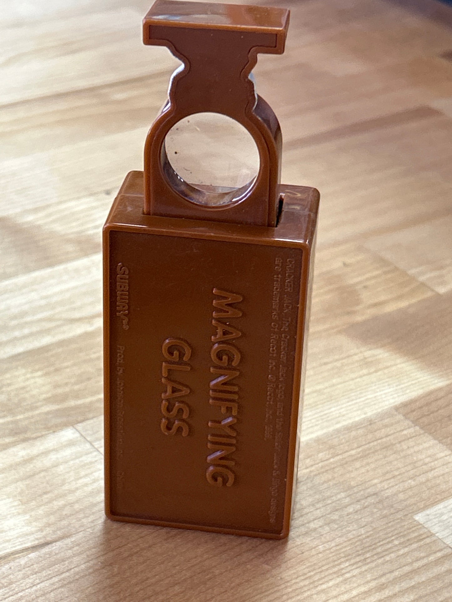 Cracker Jack (push button, pop out magnifying glass)