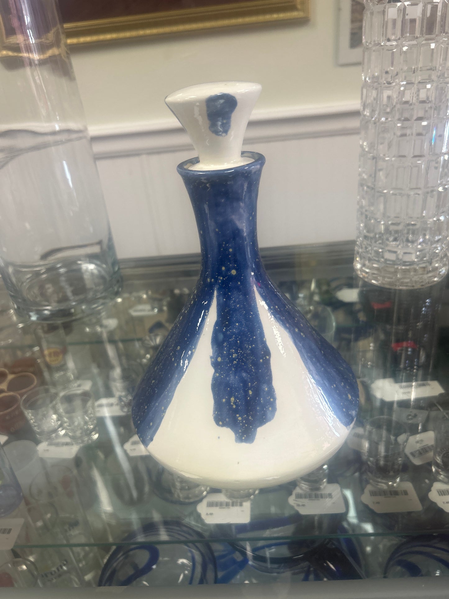 Vase Blue and white 10” including stopper. Not marked but well done and beautiful