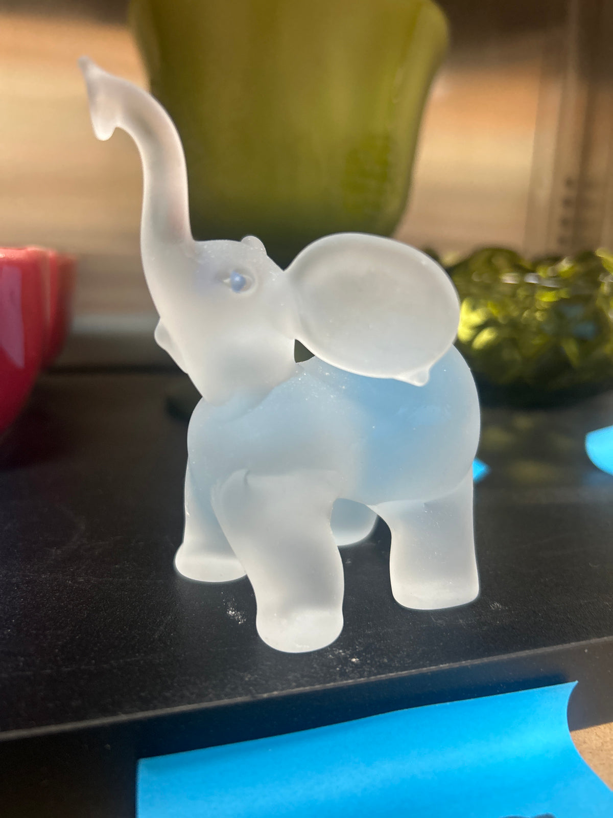 Vintage frosted glass elephant with a trunk-up pose