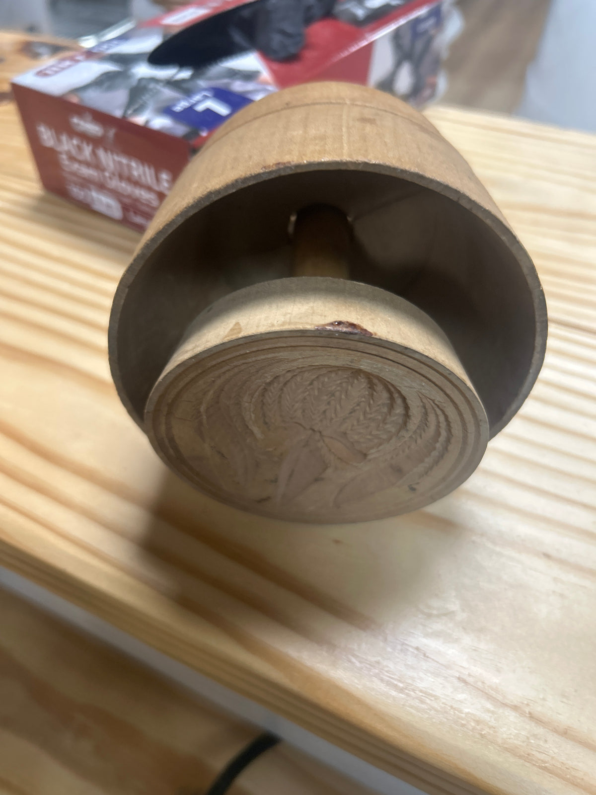 vintage wooden plunger-style butter mold has cracks