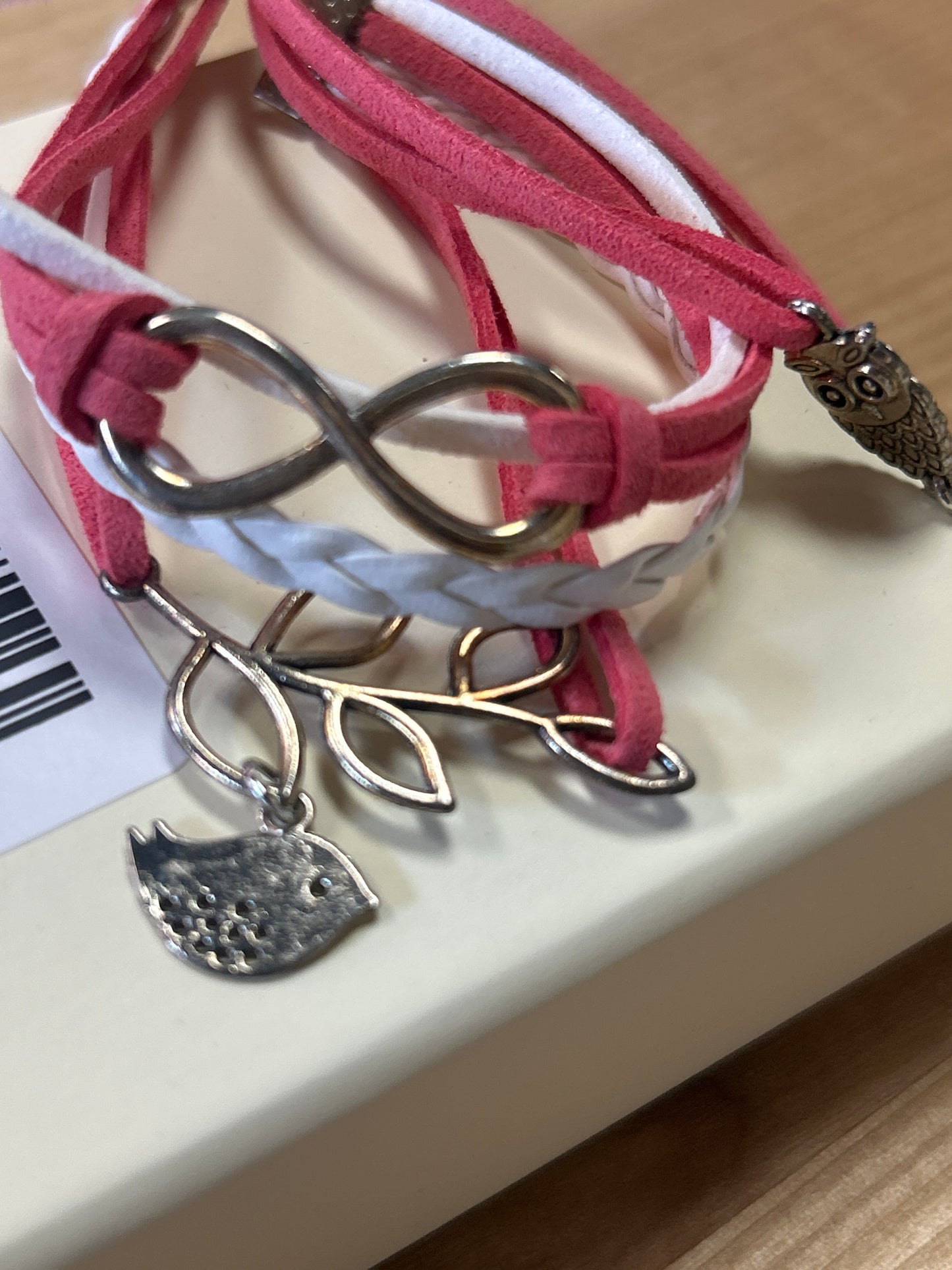 Pink and white charm bracelet