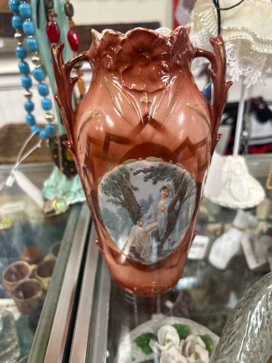 Vintage porcelain vase with portrait of a lady in a tree
