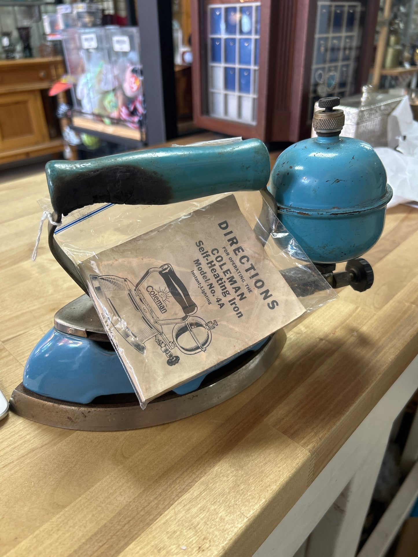 Coleman Model 4A Self-Heating Iron w/ instructional pamphlet (burnt handle)