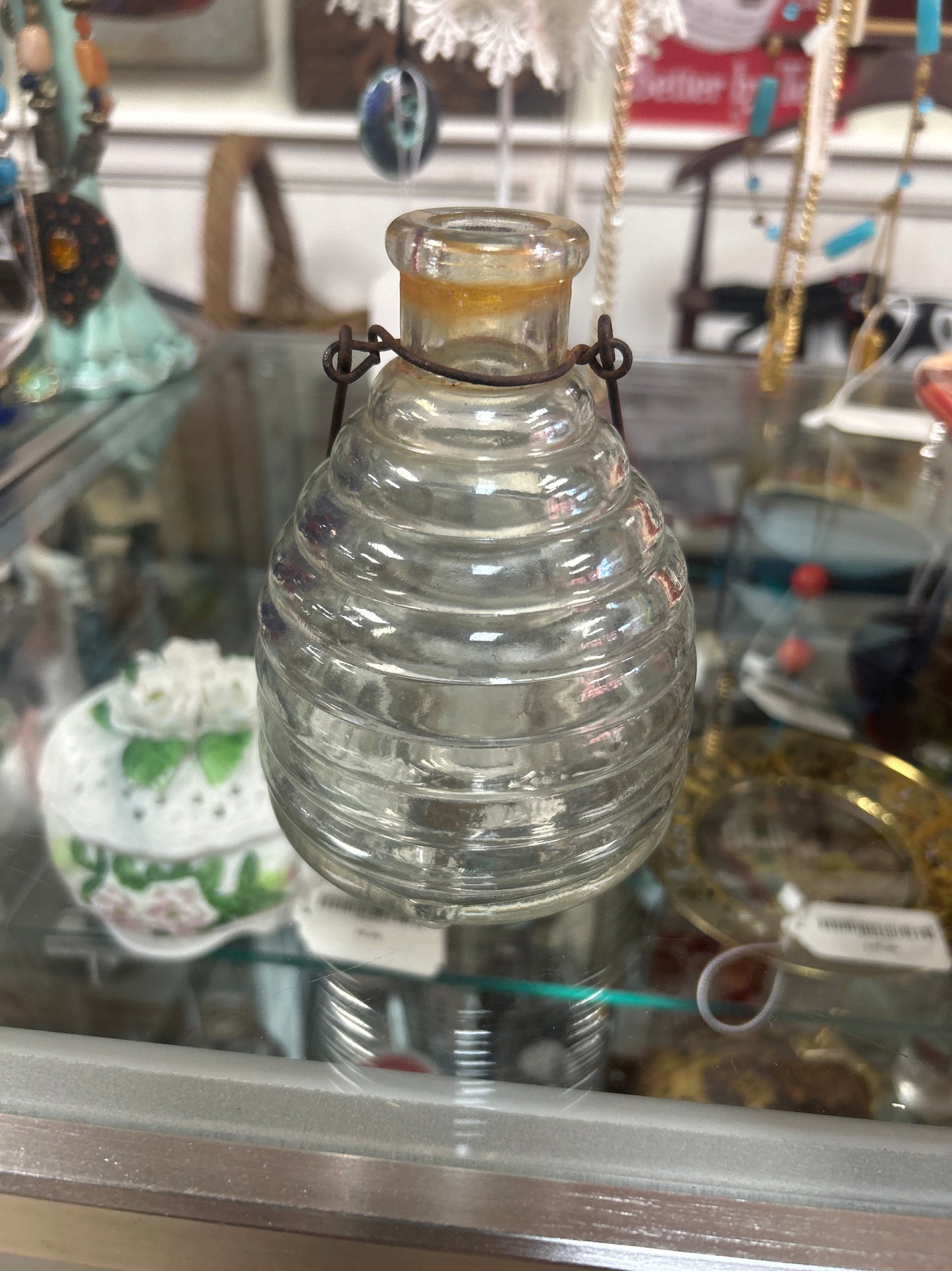 antique clear glass beehive-shaped wasp and fly trap bottle.