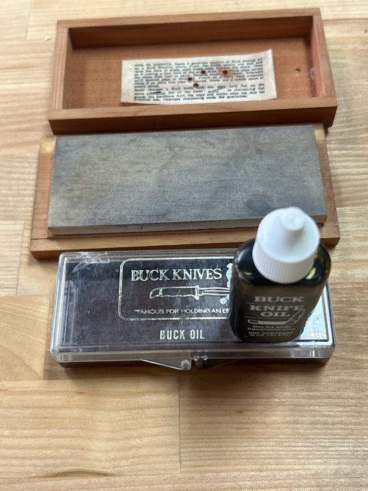 Buck oil and stone. Not matched set.