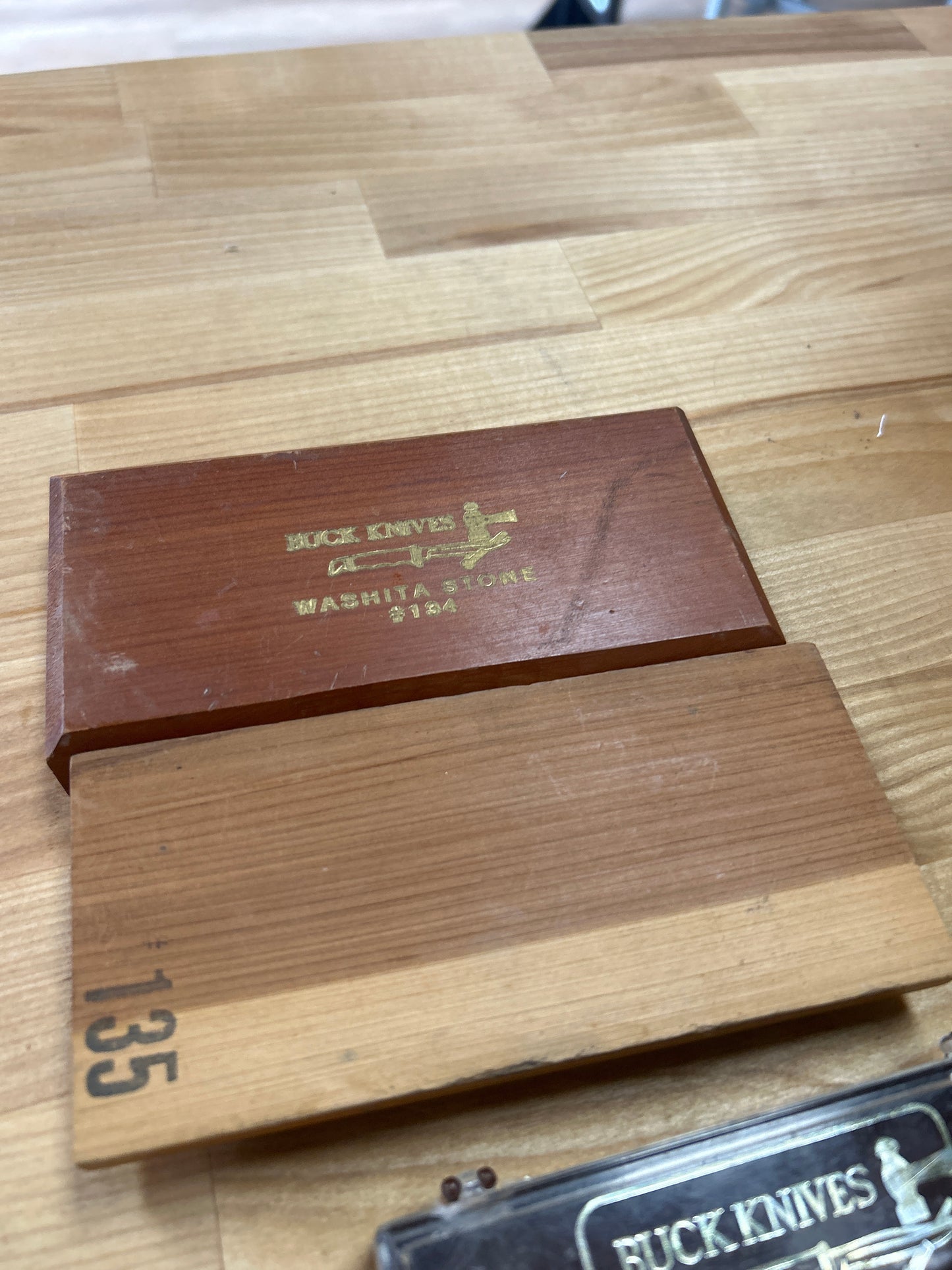 Buck oil and stone. Not matched set.
