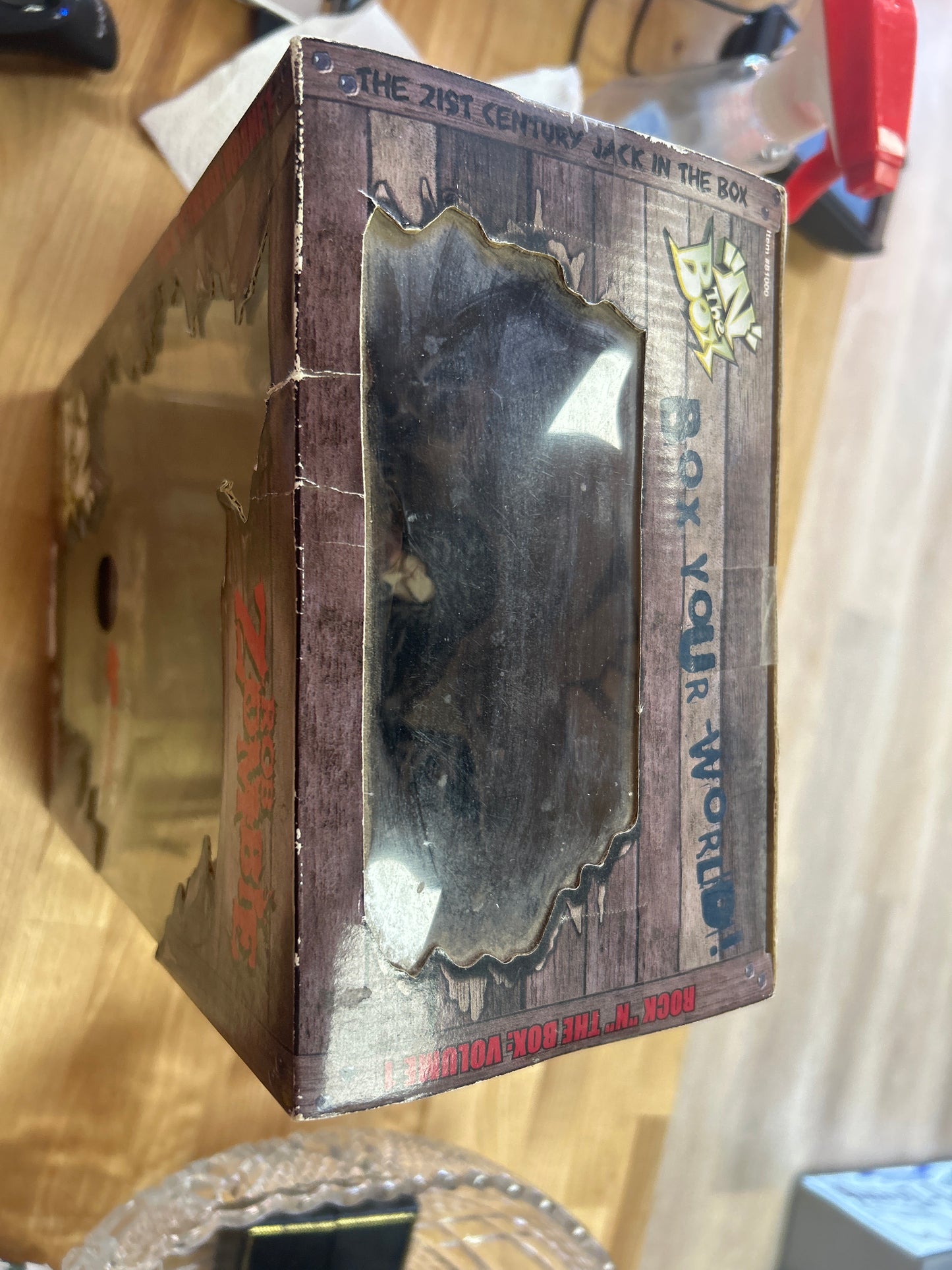 Rock ‘N The Box: Rob Zombie Figure. Box is a little dirty and has a few small tears and creases but it is unopened and sealed with original tape. Working! NIB
