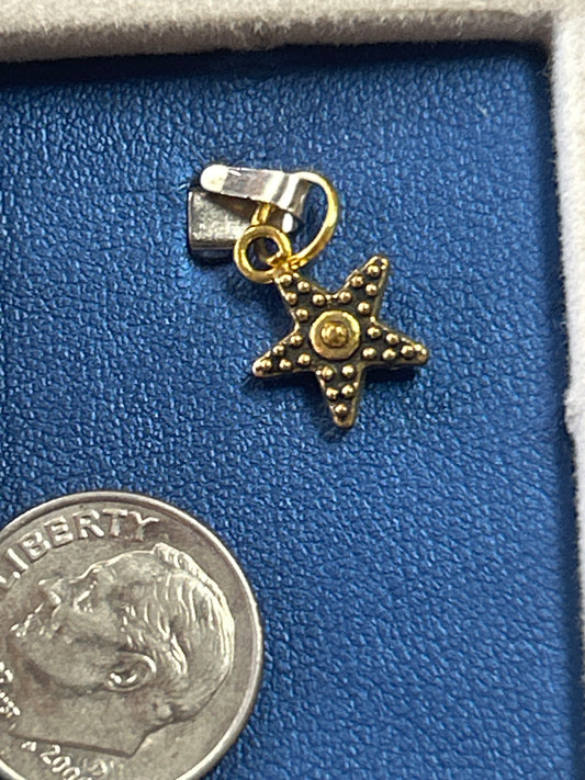 Charm (small star w circle center)