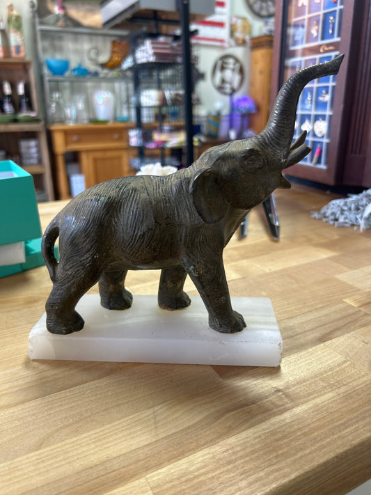 Brass elephant on marble base