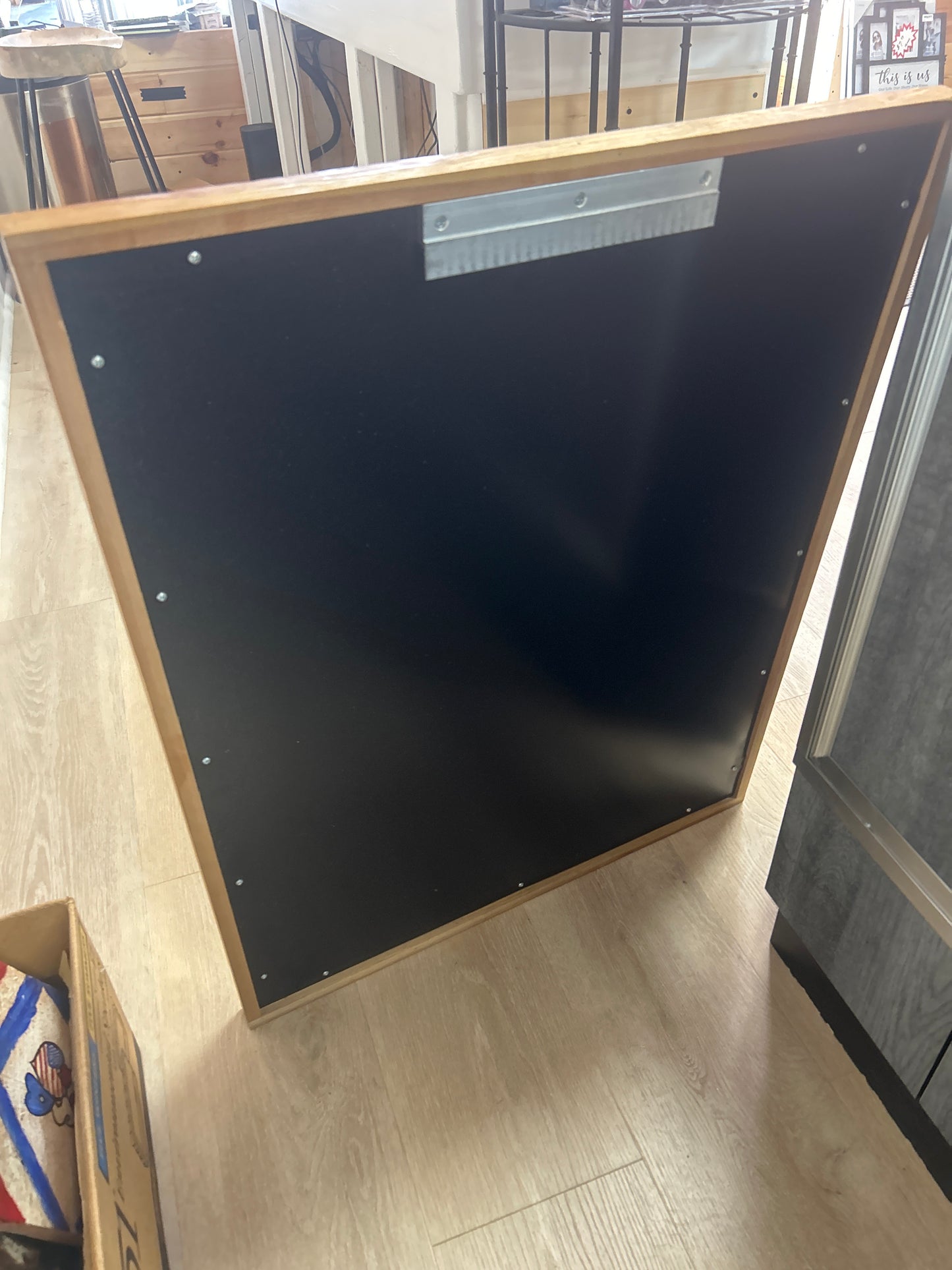 The Howard Company metal back wood frame displays 27.5”x34.5”