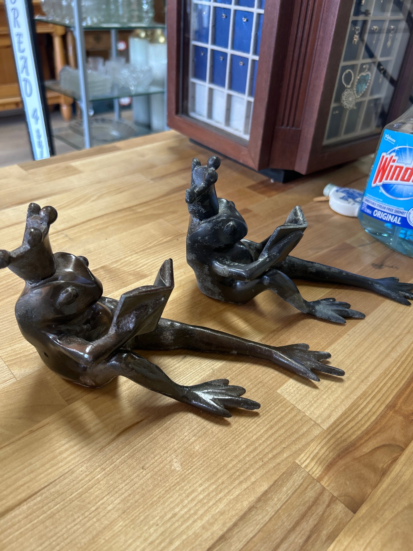 Set of Restoration Hardware Frog Prince Cast Bronze Bookends 8.25", Long Frog Legs King Crown Reading a Book, Heavy Metal. One seems gray and the other bronze color