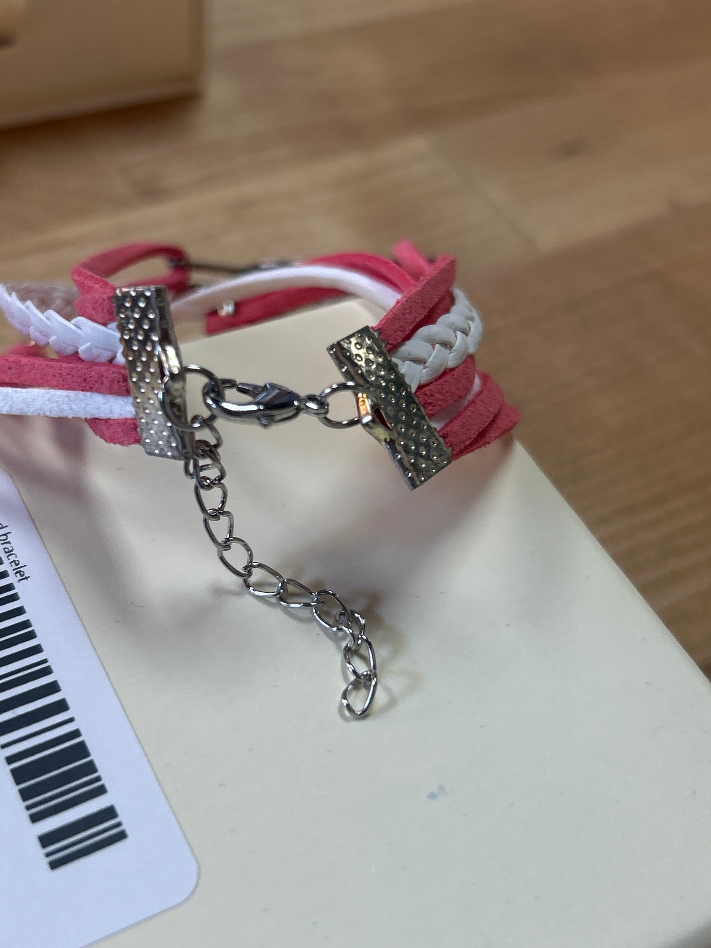 Pink and white charm bracelet