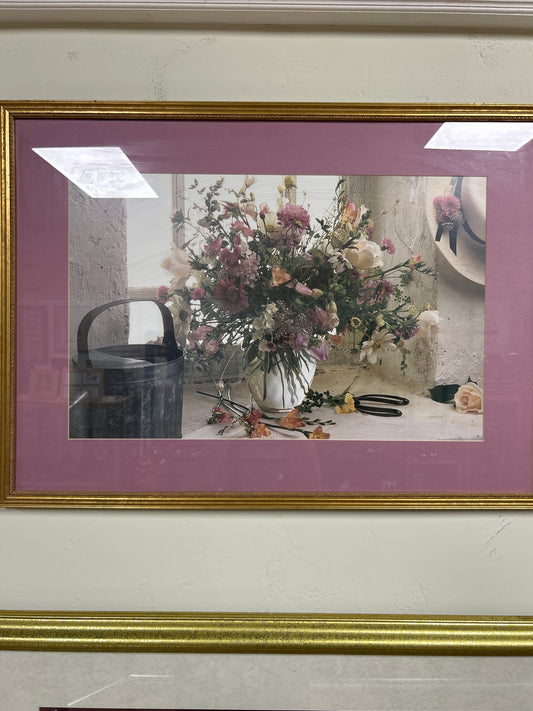Framed and matted print of a flower arrangement