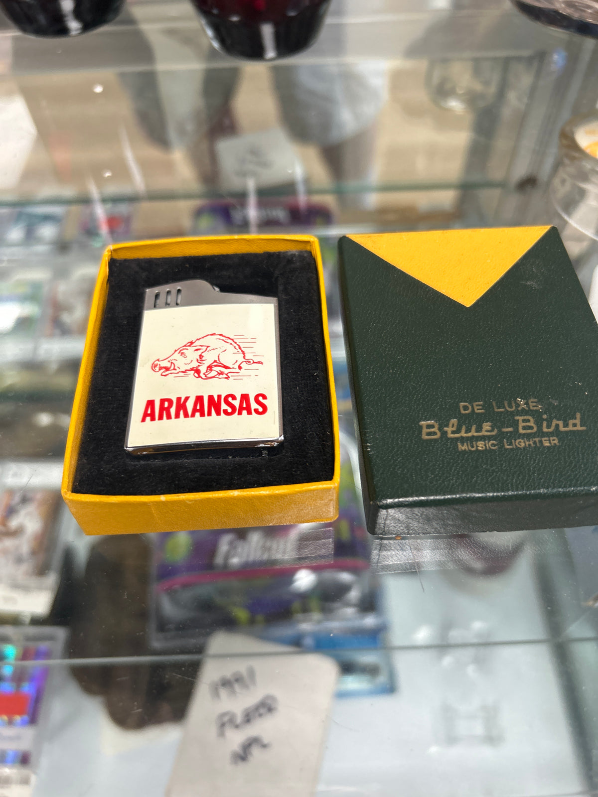 De Luxe Blue-Bird Arkansas Razorbacks musical pocket lighter complete with its original two-tone presentation box