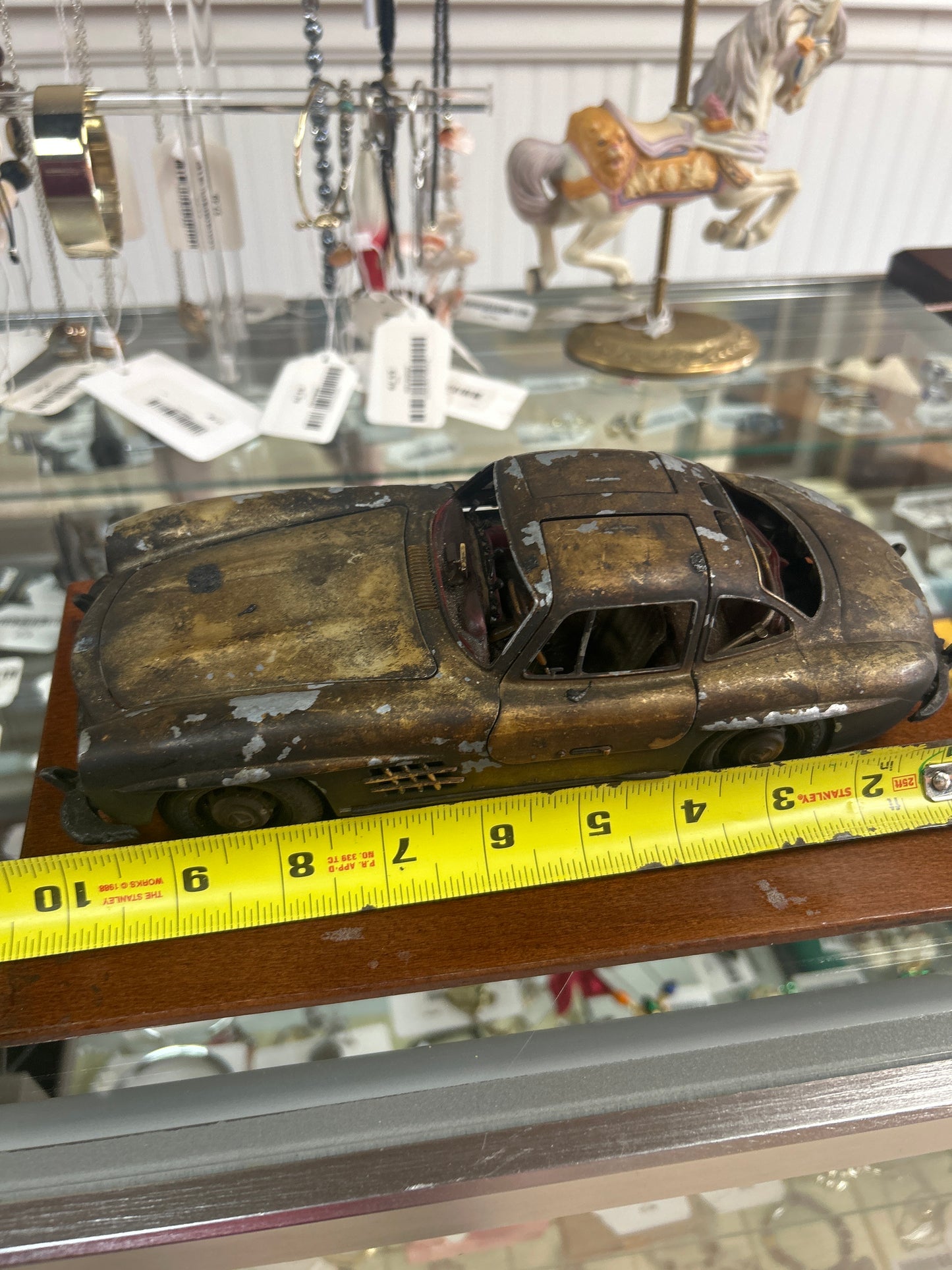 Preowned Die cast model of a 1954 Mercedes-Benz 300 SL Gullwing (see photos for condition. Beat up in a good way)