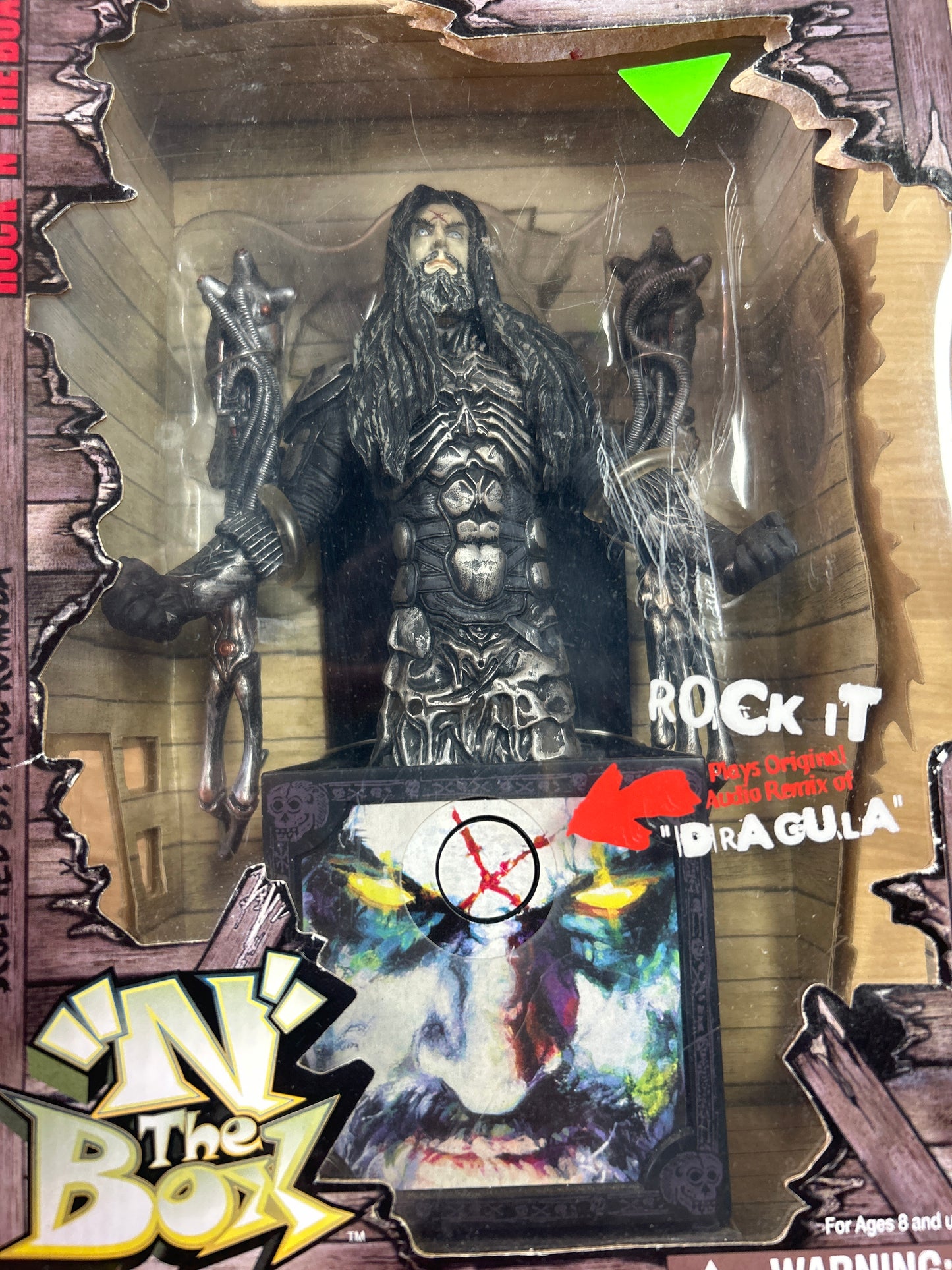 Rock ‘N The Box: Rob Zombie Figure. Box is a little dirty and has a few small tears and creases but it is unopened and sealed with original tape. Working! NIB