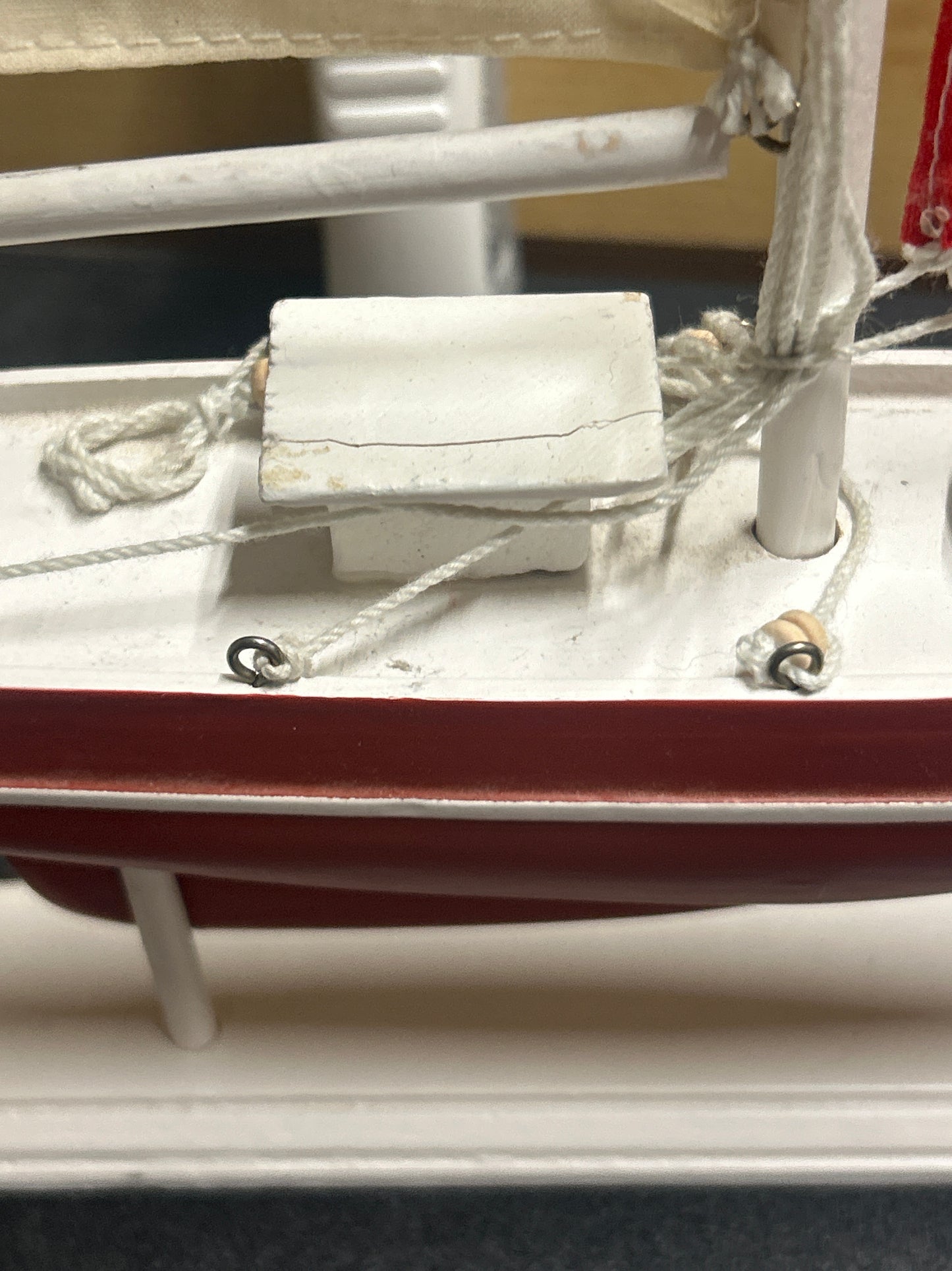 Wooden sail boat on stand