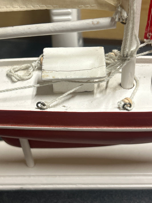Wooden sail boat on stand