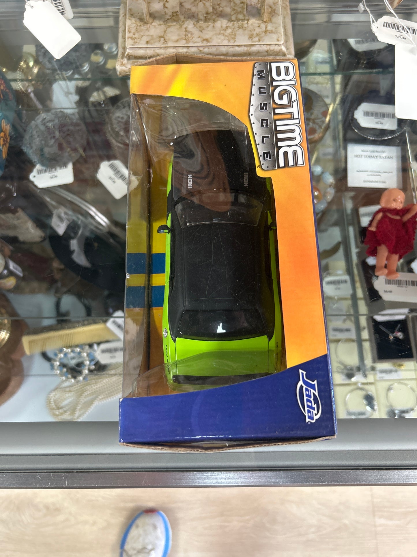 a "Bigtime Muscle" die-cast model car by Jada Toys. The specific model is a 2008 Dodge Challenger SRT8
