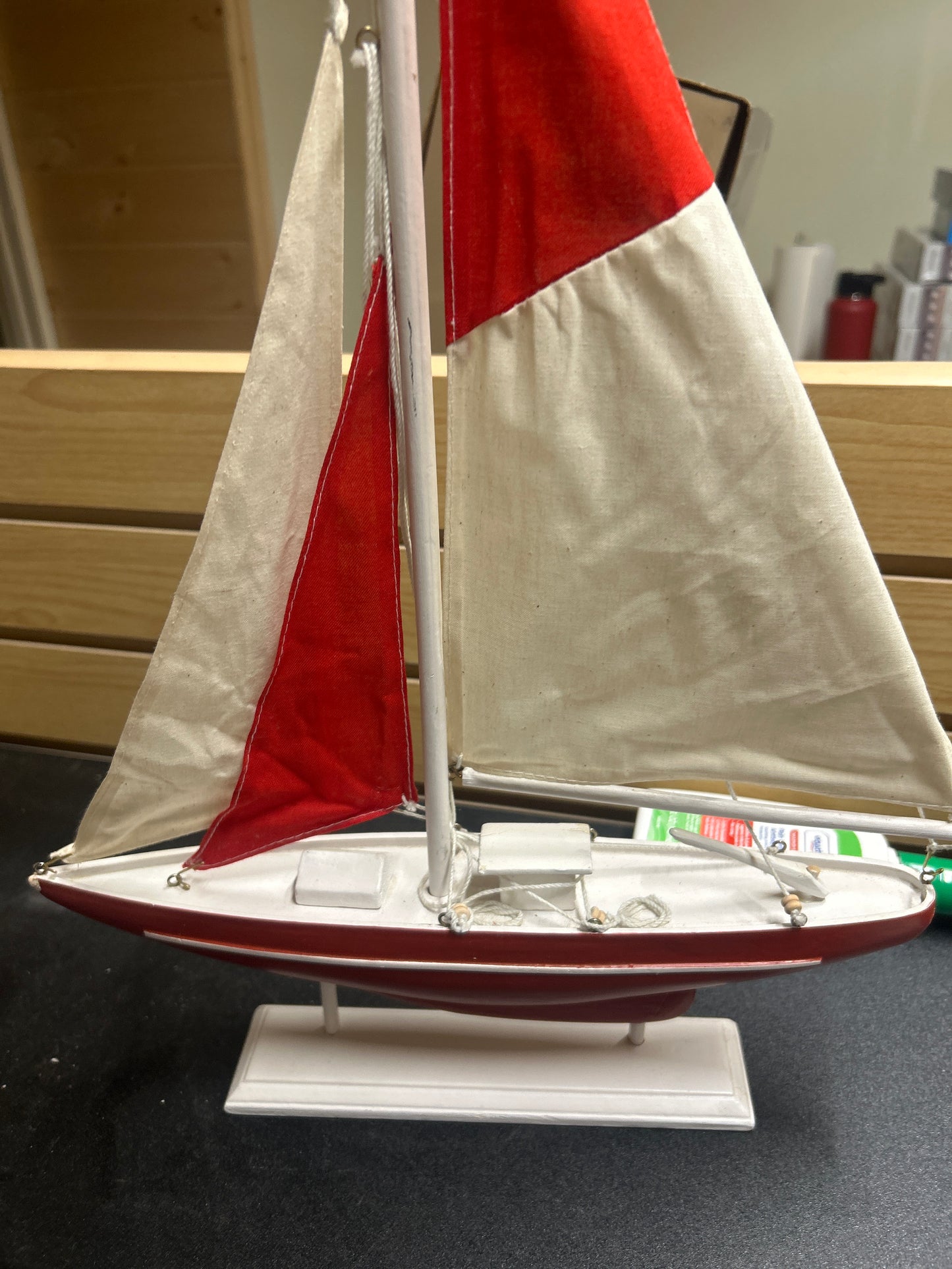 Wooden sail boat on stand
