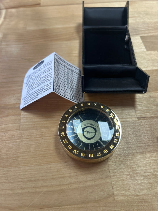 Vintage Brass Time-zone Dial Clock. Concordia on face. Snap in black case is broken. But Dail is in excellent condition