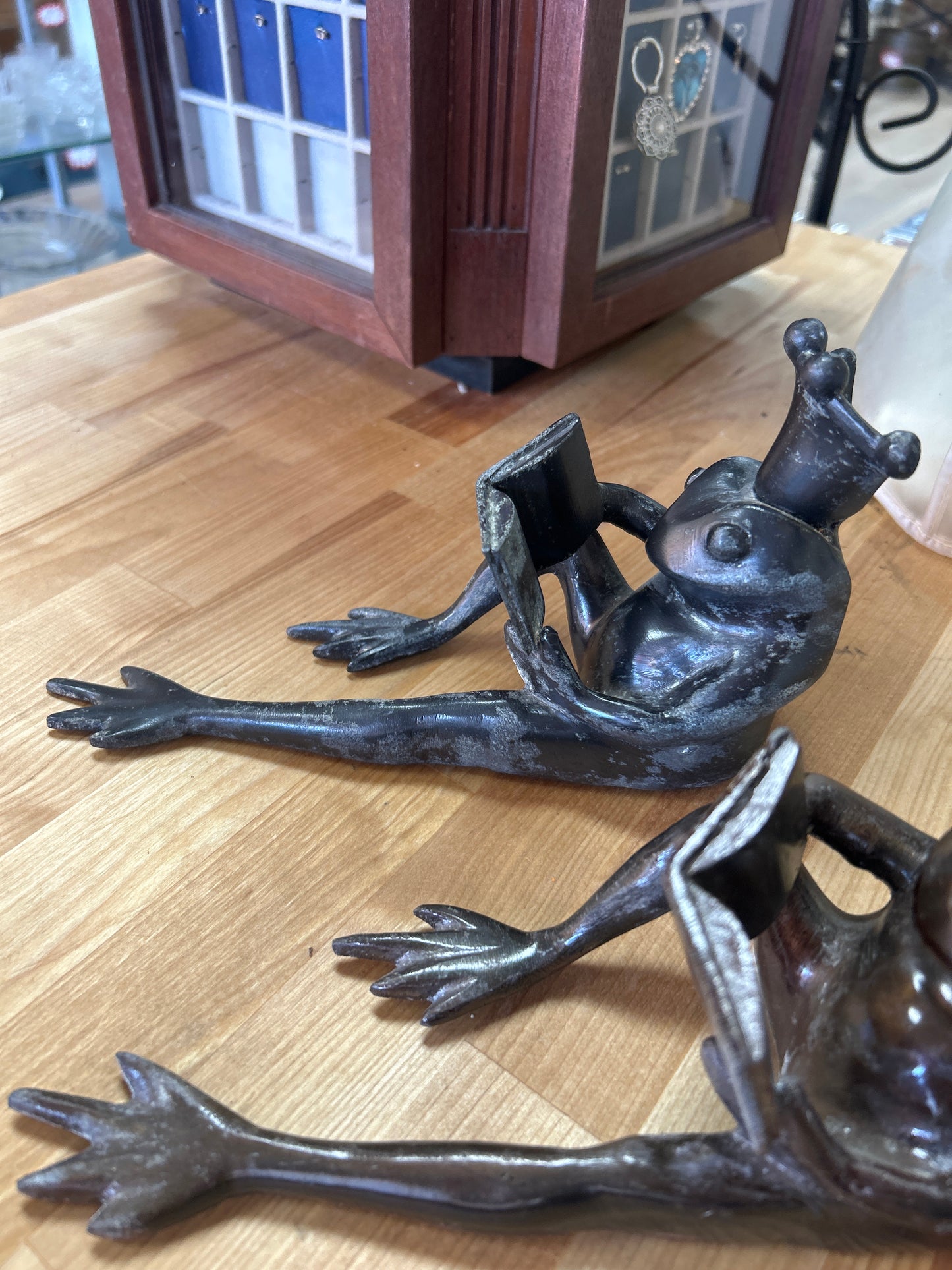 Set of Restoration Hardware Frog Prince Cast Bronze Bookends 8.25", Long Frog Legs King Crown Reading a Book, Heavy Metal. One seems gray and the other bronze color