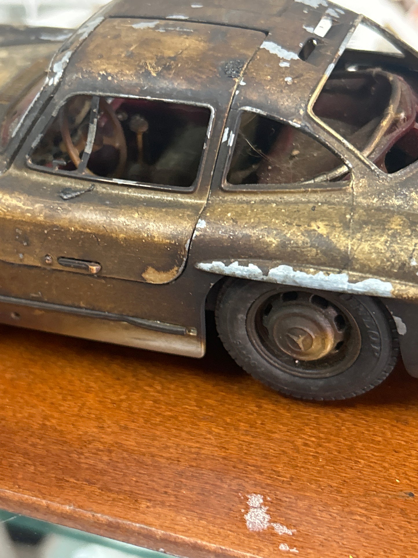 Preowned Die cast model of a 1954 Mercedes-Benz 300 SL Gullwing (see photos for condition. Beat up in a good way)