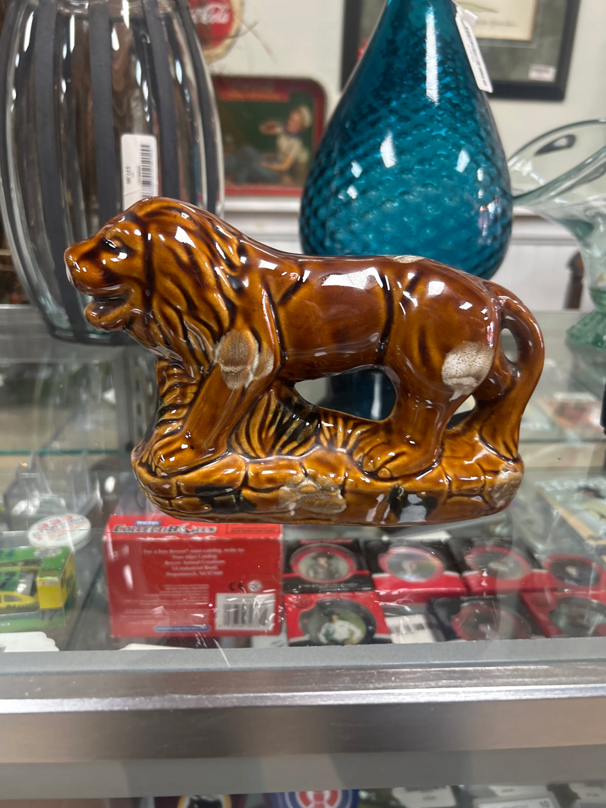 Vintage ceramic lion figurine featuring a brown drip glaze finish