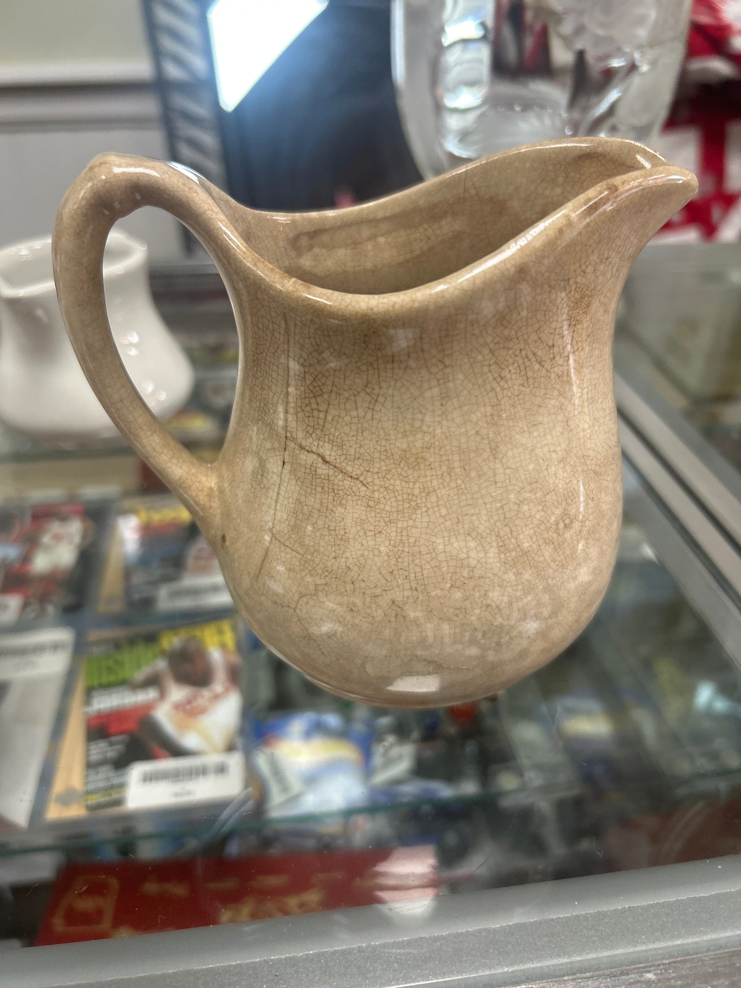 Antique ironstone pitcher with great browning and crazing; unmarked 5”