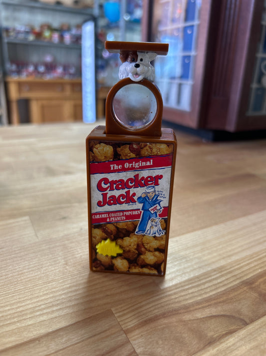 Cracker Jack (push button, pop out magnifying glass)