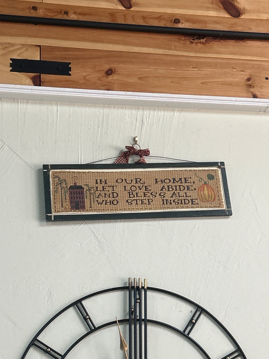 "In our home let love" sign