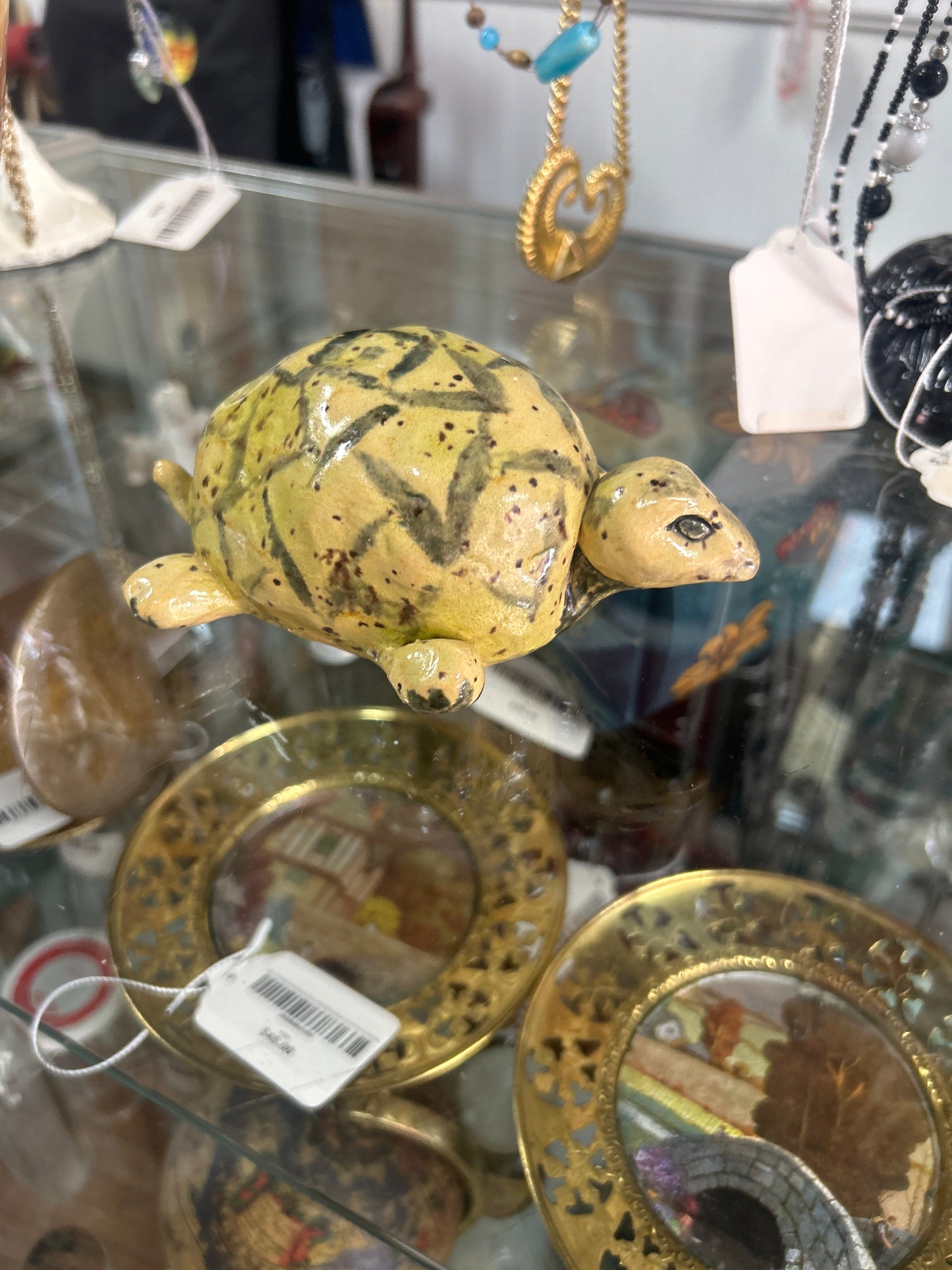 vintage 1970s yellow ceramic turtle figurine featuring a dark marbled