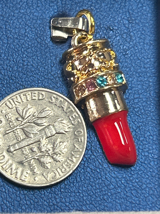 Charm (lipstick medium red and gold)