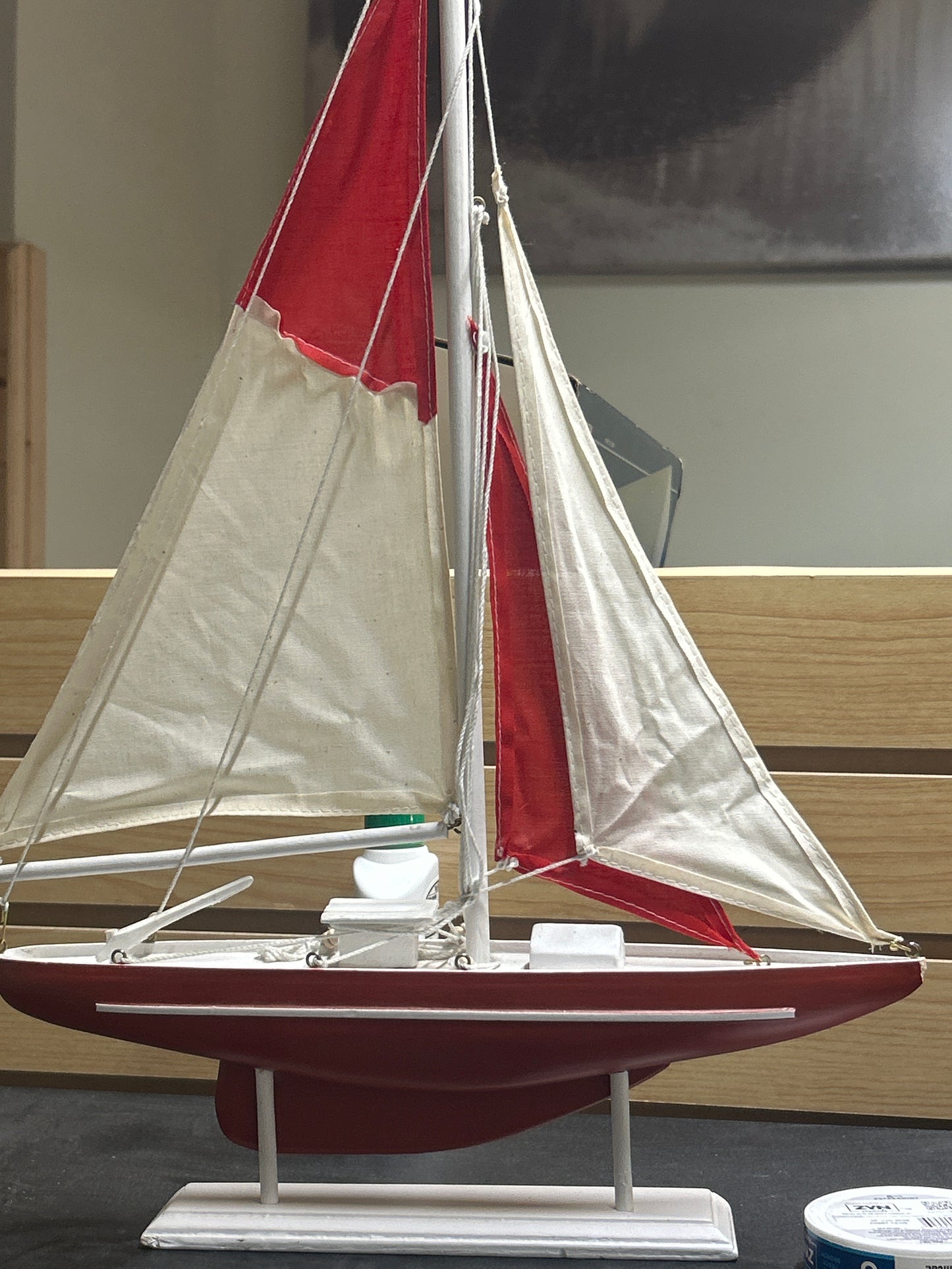 Wooden sail boat on stand
