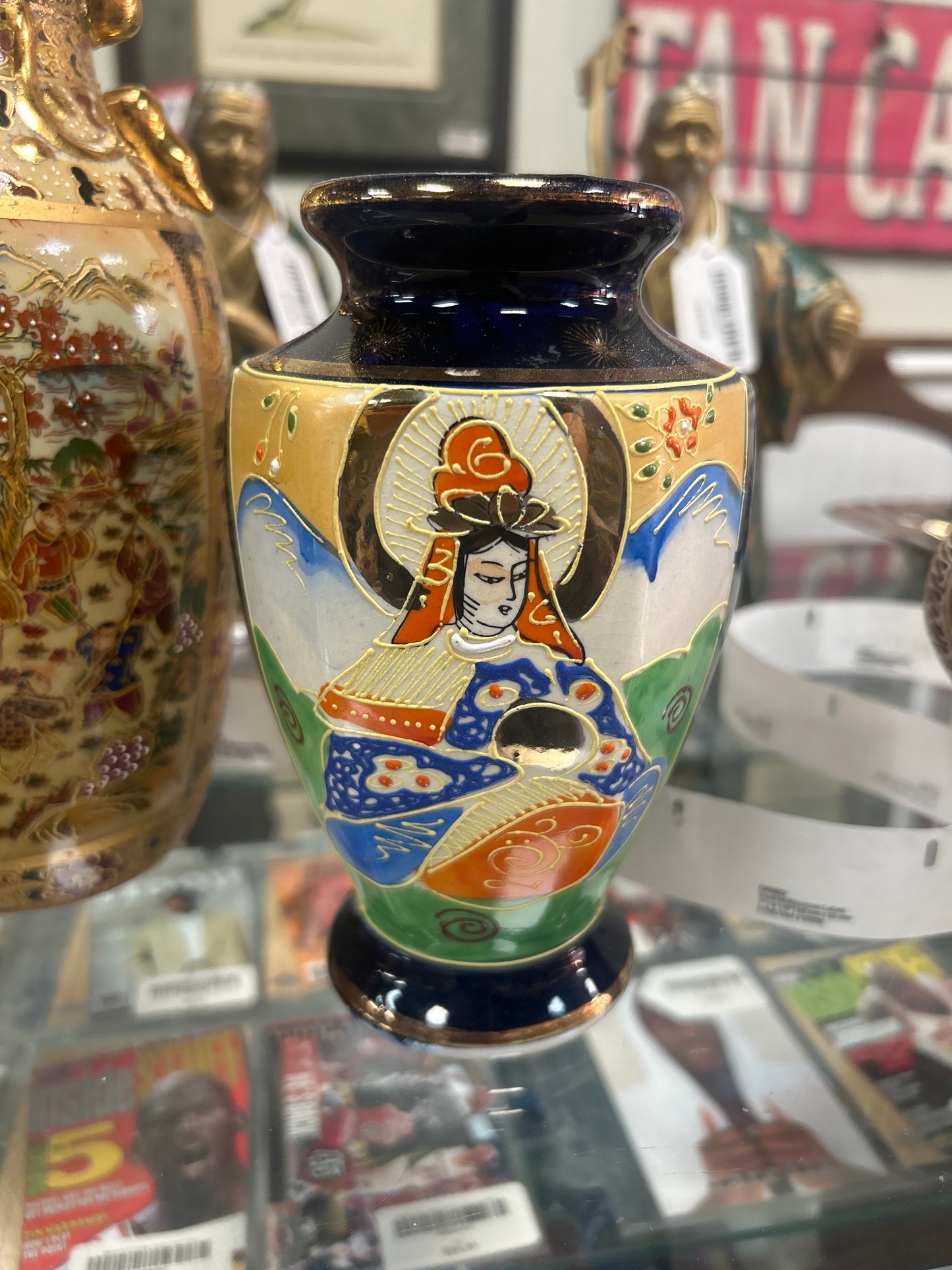Japanese Satsuma vase intricate moriage detailing and a vibrant cobalt blue rim