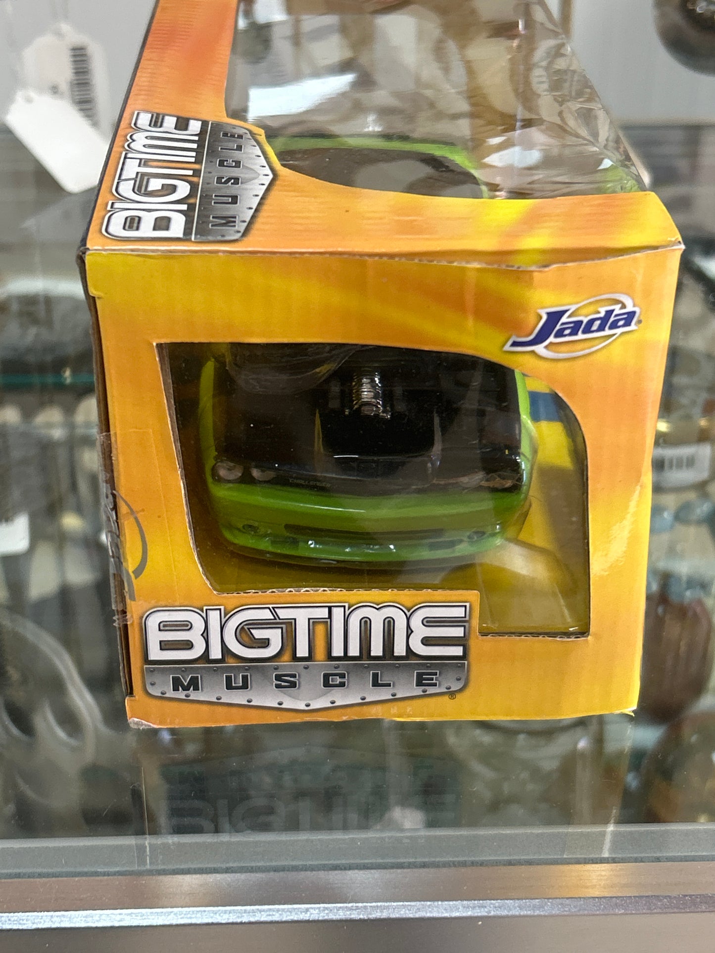 a "Bigtime Muscle" die-cast model car by Jada Toys. The specific model is a 2008 Dodge Challenger SRT8